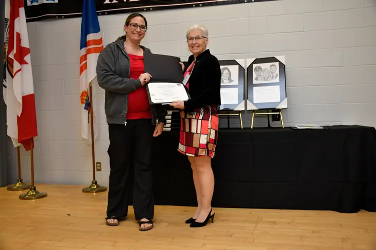 Rowing club volunteer receiving award