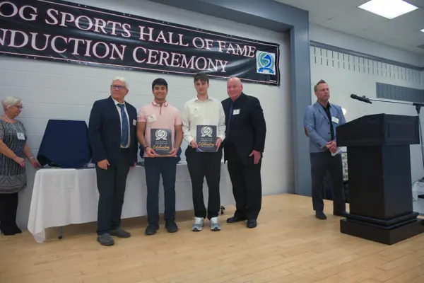 two young men receiving awards